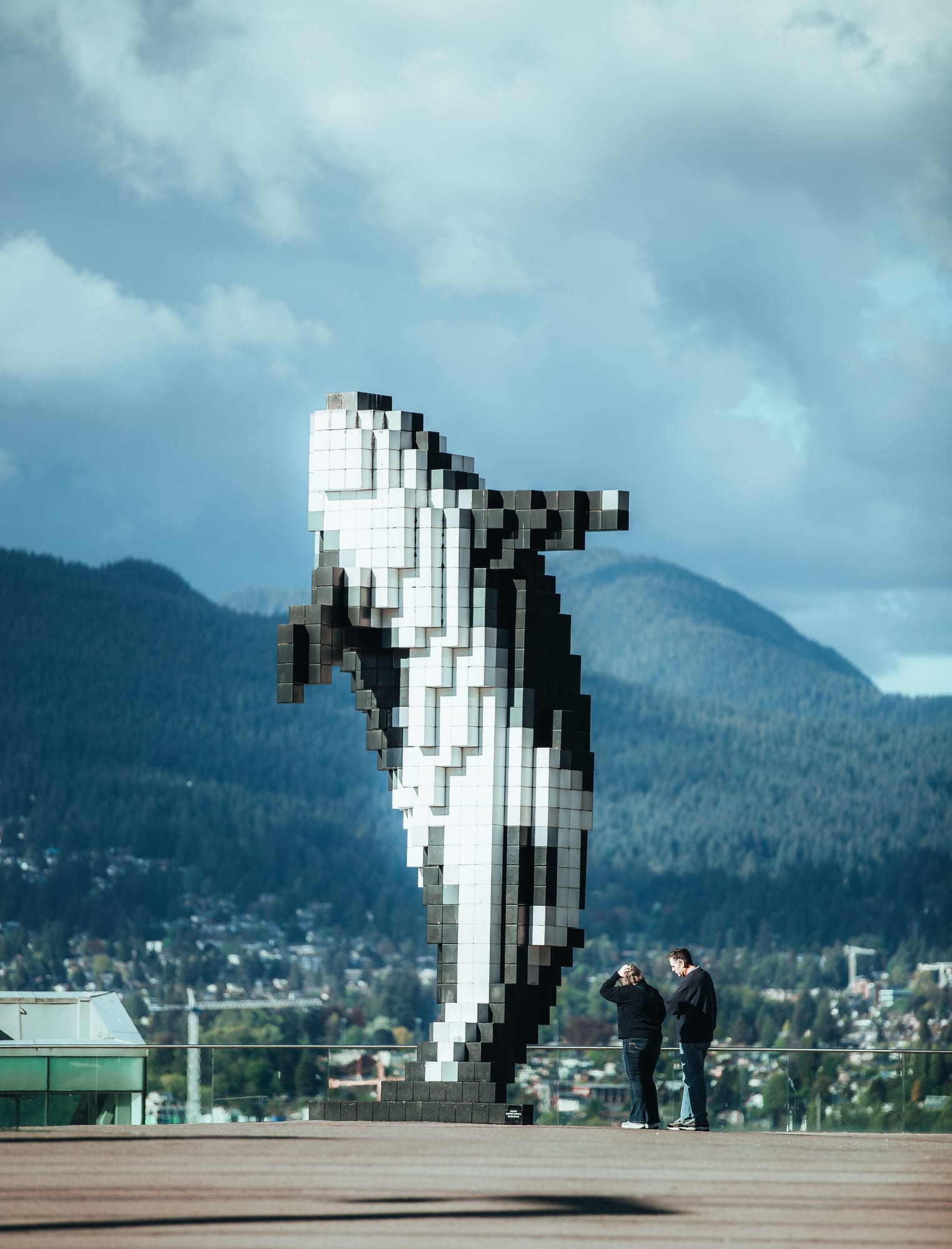 Digital Orca — pixelated orca sculpture, waterfront backdrop