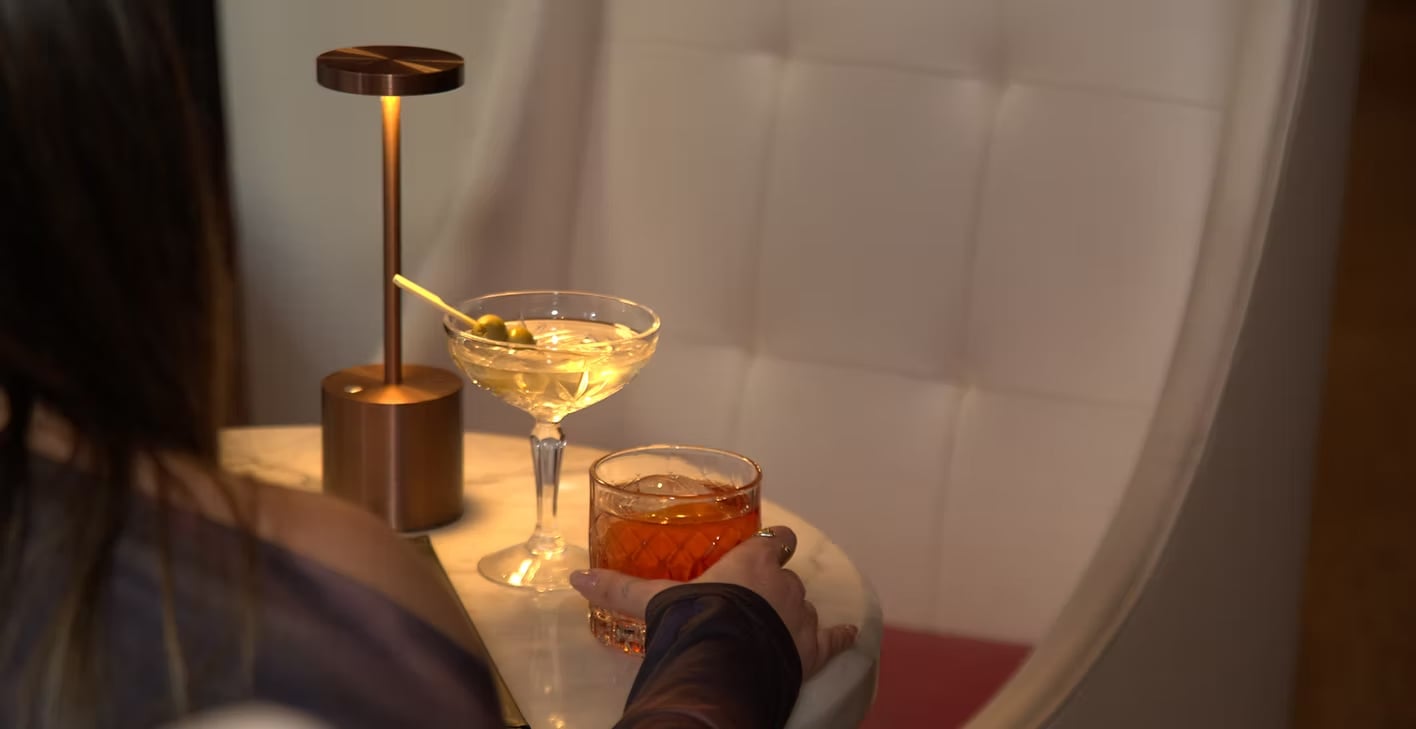 Uva Wine & Cocktail Bar — low light, marble counter, single coupe