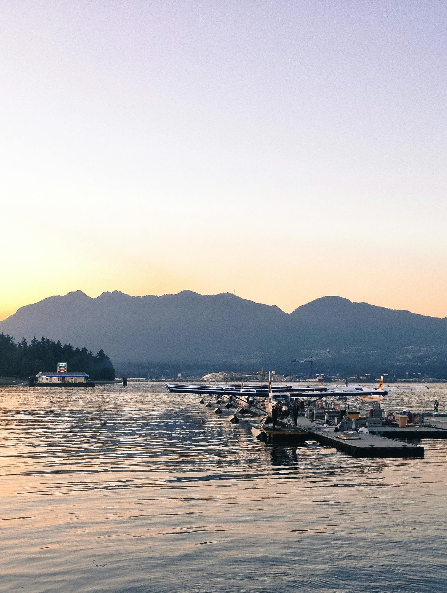 Coal Harbour — marina yachts, glass towers, mountain backdrop